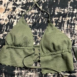 A green crocheted bikini top